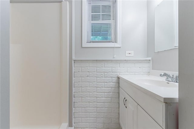 260 Pleasant Grove Cir, Mcdonough, GA 30252 - bathroom with vanity and tile walls