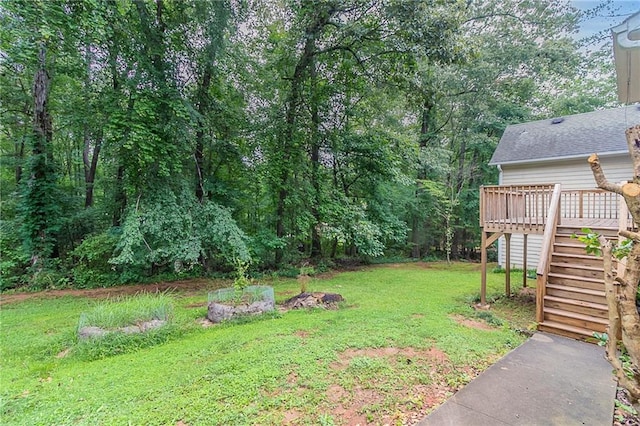 260 Pleasant Grove Cir, Mcdonough, GA 30252 - view of green lawn with stairs and a wooden deck
