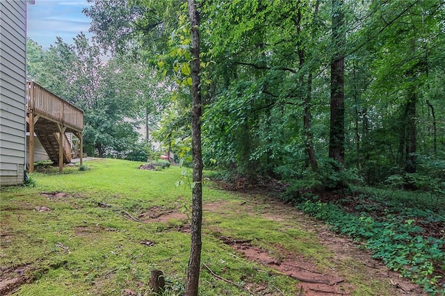260 Pleasant Grove Cir, Mcdonough, GA 30252 - view of green lawn featuring stairway and a deck