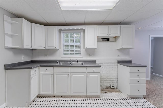 260 Pleasant Grove Cir, Mcdonough, GA 30252 - kitchen featuring a sink, a paneled ceiling, white cabinets, and dark countertops