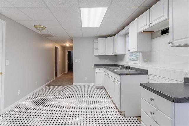 260 Pleasant Grove Cir, Mcdonough, GA 30252 - kitchen with a sink, white cabinets, a paneled ceiling, and decorative backsplash