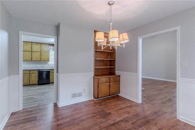260 Pleasant Grove Cir, Mcdonough, GA 30252 - unfurnished dining area featuring a chandelier, wood finished floors, and baseboards