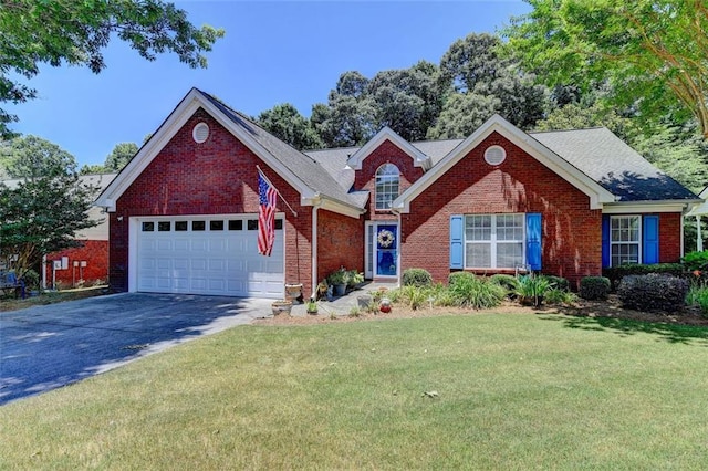 view of front of home with a garage and a front lawn