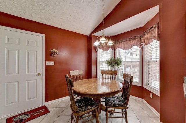 tiled dining room with a notable chandelier, lofted ceiling, and a textured ceiling