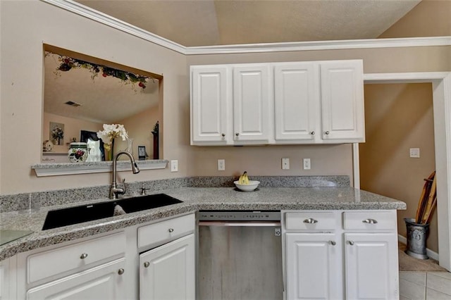 kitchen featuring dishwasher, white cabinetry, and lofted ceiling