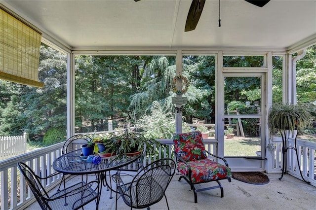 sunroom featuring ceiling fan