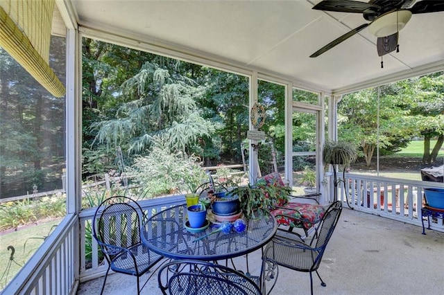 sunroom featuring ceiling fan and a healthy amount of sunlight