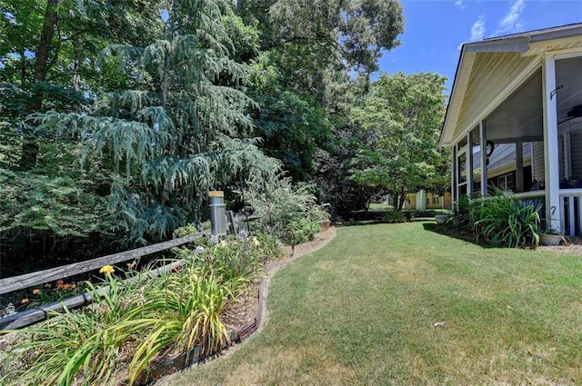 view of yard featuring a sunroom