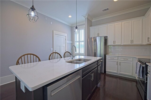 kitchen featuring visible vents, a sink, white cabinets, and stainless steel appliances
