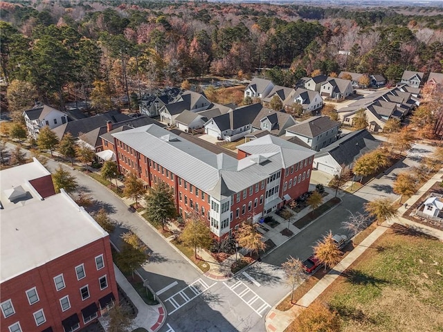 birds eye view of property featuring a forest view