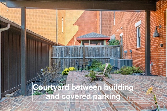 view of patio / terrace featuring fence and cooling unit