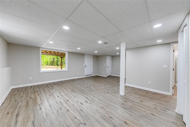 basement with baseboards, recessed lighting, and wood finished floors