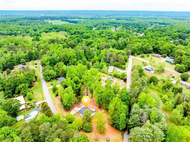 drone / aerial view featuring a view of trees