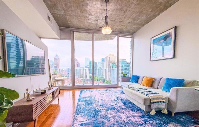860 Peachtree St NE Unit 1411, Atlanta, GA 30308 - living room with wood finished floors and floor to ceiling windows