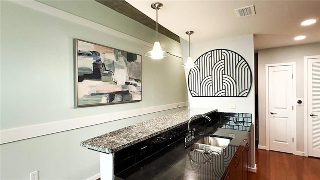 860 Peachtree St NE Unit 1411, Atlanta, GA 30308 - kitchen with a sink, recessed lighting, dark wood-type flooring, and decorative light fixtures