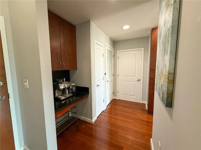 860 Peachtree St NE Unit 1411, Atlanta, GA 30308 - hallway featuring dark wood-style floors, baseboards, and recessed lighting