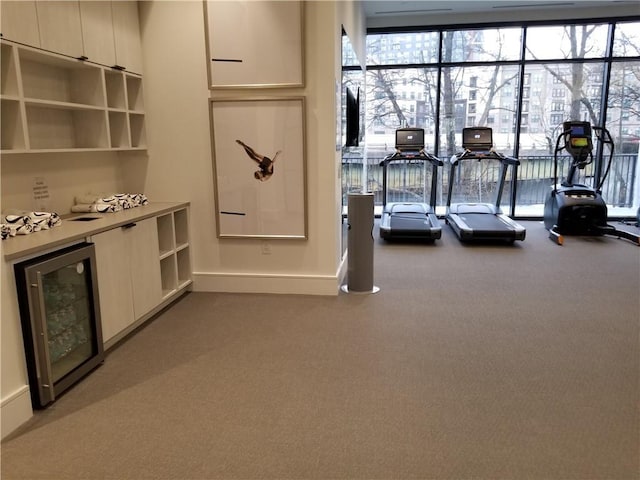 workout area with wine cooler and carpet