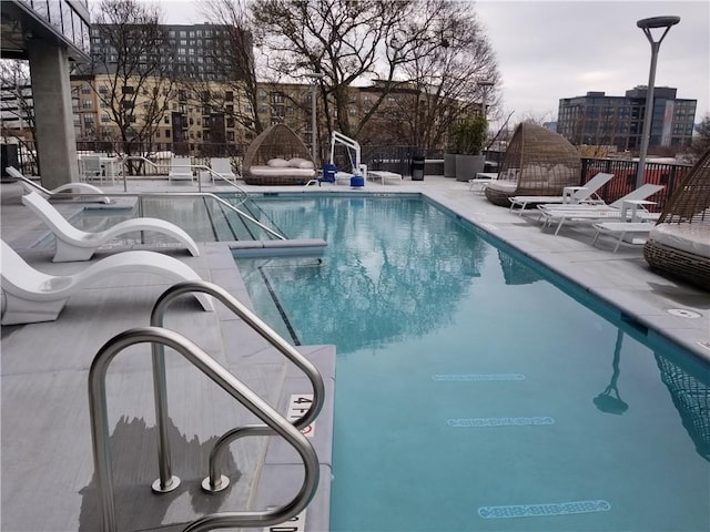 view of swimming pool with a patio area