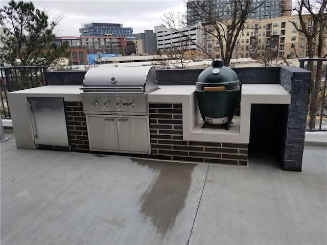 view of patio featuring grilling area and exterior kitchen