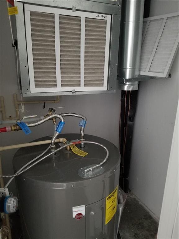 utility room with water heater