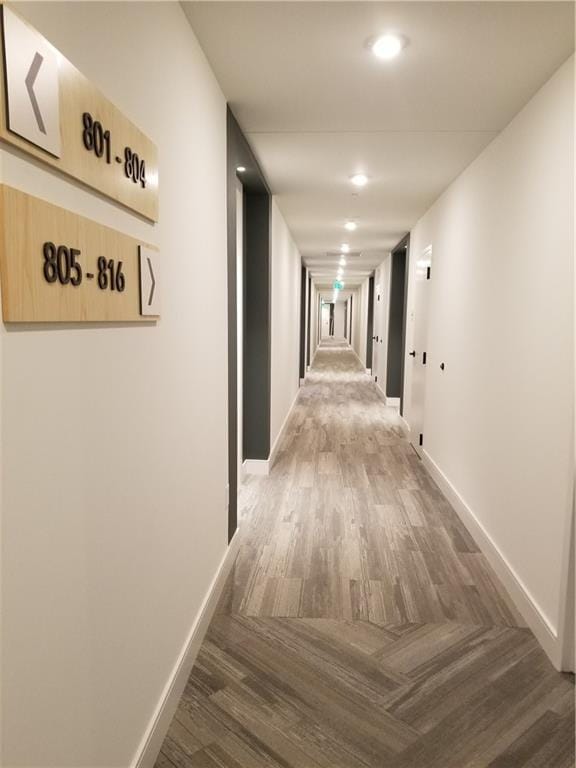 hall with dark hardwood / wood-style floors