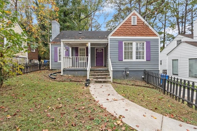 bungalow-style house featuring a front yard and a porch