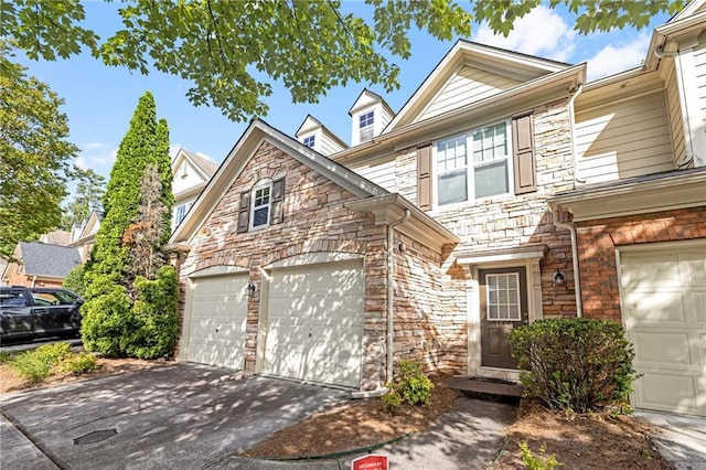 1804 Evadale Ct Unit 1, Mableton, GA 30126 - view of front of property featuring stone siding, driveway, and an attached garage