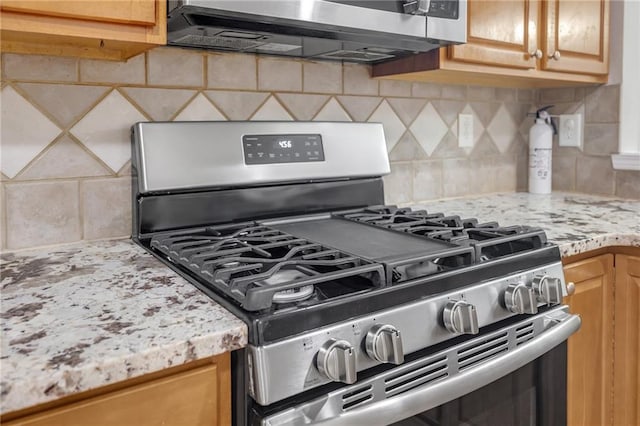 1804 Evadale Ct Unit 1, Mableton, GA 30126 - kitchen with stainless steel appliances, decorative backsplash, and light stone countertops