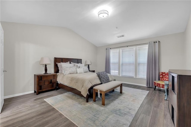 1804 Evadale Ct Unit 1, Mableton, GA 30126 - bedroom with lofted ceiling and dark wood-style flooring