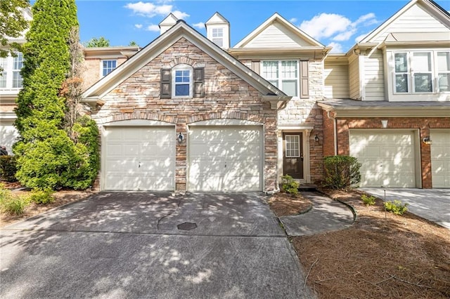 1804 Evadale Ct Unit 1, Mableton, GA 30126 - view of front of property featuring concrete driveway, an attached garage, and stone siding