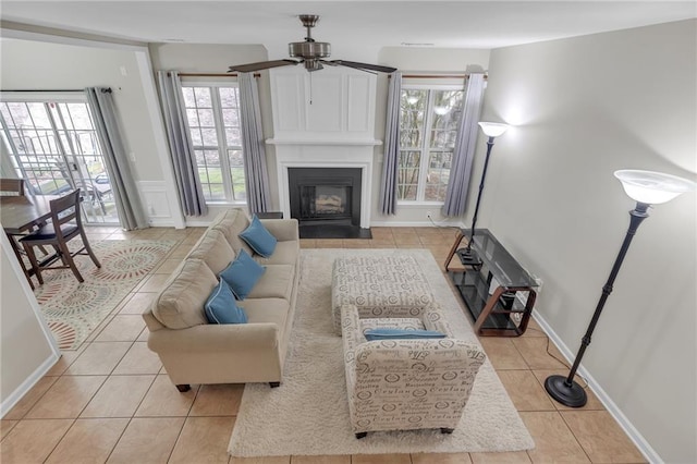 1804 Evadale Ct Unit 1, Mableton, GA 30126 - living area with light tile patterned floors, ceiling fan, a fireplace with flush hearth, and wainscoting