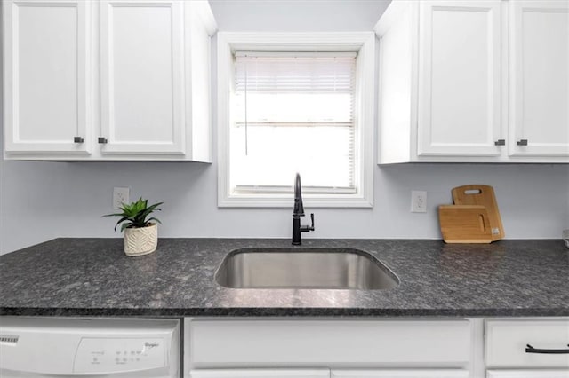 kitchen with sink, white cabinetry, and dishwasher