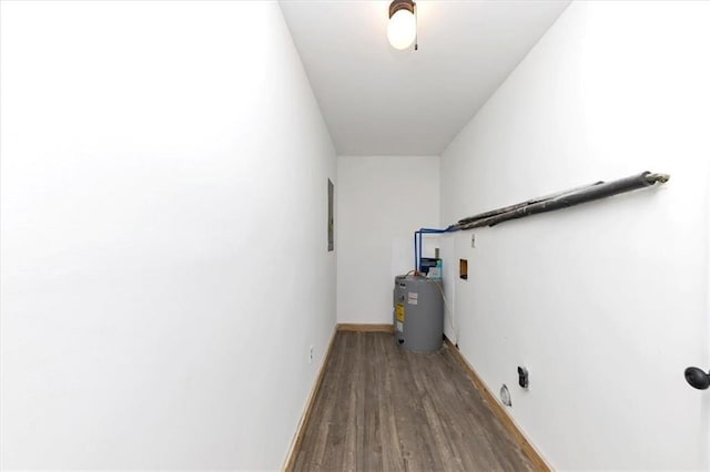 laundry room with wood-type flooring, electric water heater, and electric panel