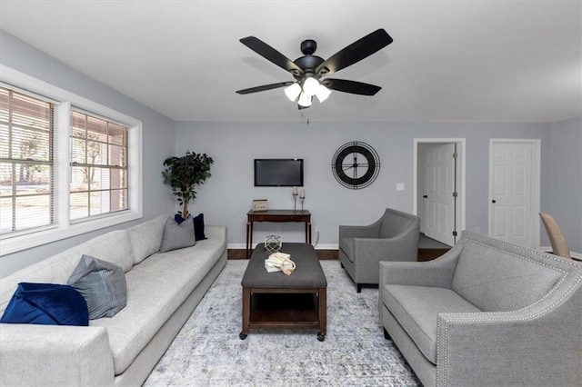 living room featuring hardwood / wood-style flooring and ceiling fan