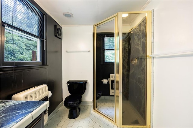 3272 Pinestream Rd NW, Atlanta, GA 30327 - bathroom featuring plenty of natural light, a shower stall, tile patterned flooring, and ornamental molding