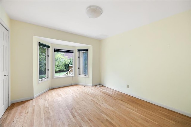 3272 Pinestream Rd NW, Atlanta, GA 30327 - spare room with light wood-style flooring and baseboards
