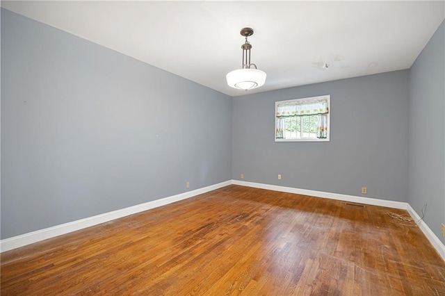 3272 Pinestream Rd NW, Atlanta, GA 30327 - unfurnished room with wood finished floors and baseboards