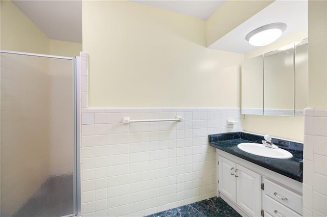 3272 Pinestream Rd NW, Atlanta, GA 30327 - bathroom featuring a shower stall, vanity, tile walls, and wainscoting