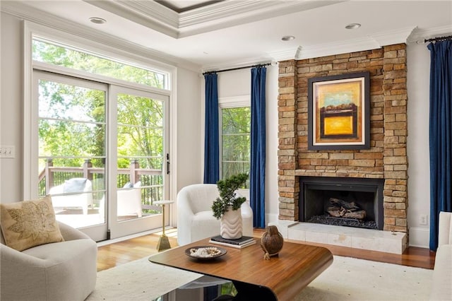 2015 N Decatur Rd NE, Atlanta, GA 30307 - living area with crown molding, a stone fireplace, and wood finished floors