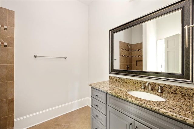 2015 N Decatur Rd NE, Atlanta, GA 30307 - full bathroom featuring tile patterned floors, tiled shower, vanity, and baseboards