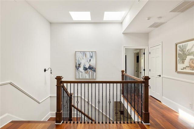 2015 N Decatur Rd NE, Atlanta, GA 30307 - hallway with visible vents, an upstairs landing, and wood finished floors