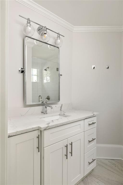 2015 N Decatur Rd NE, Atlanta, GA 30307 - bathroom with marble finish floor, a stall shower, vanity, and ornamental molding