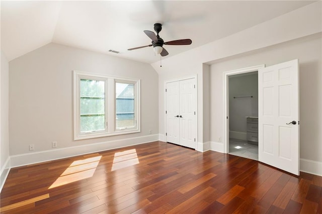 2015 N Decatur Rd NE, Atlanta, GA 30307 - unfurnished bedroom featuring a closet, baseboards, vaulted ceiling, visible vents, and wood finished floors