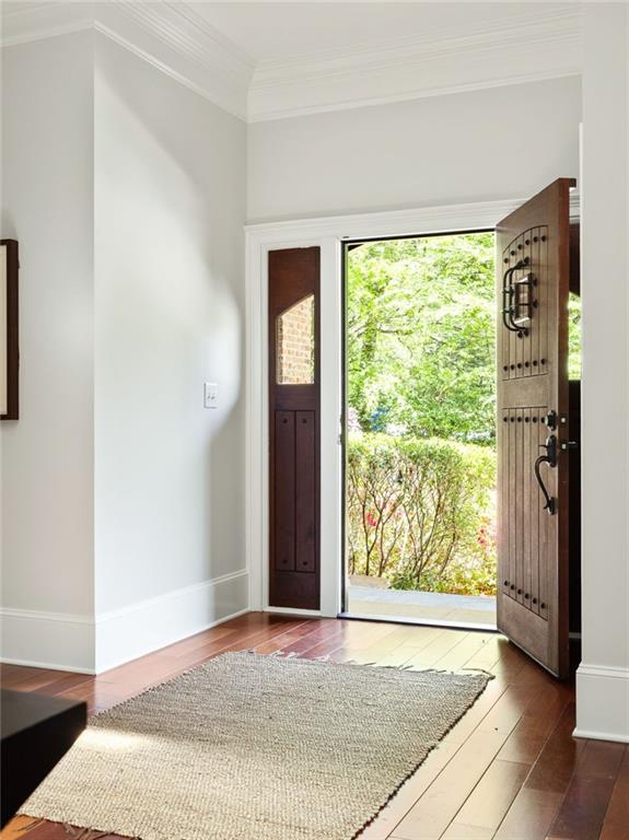 2015 N Decatur Rd NE, Atlanta, GA 30307 - entrance foyer featuring ornamental molding, baseboards, and dark wood finished floors