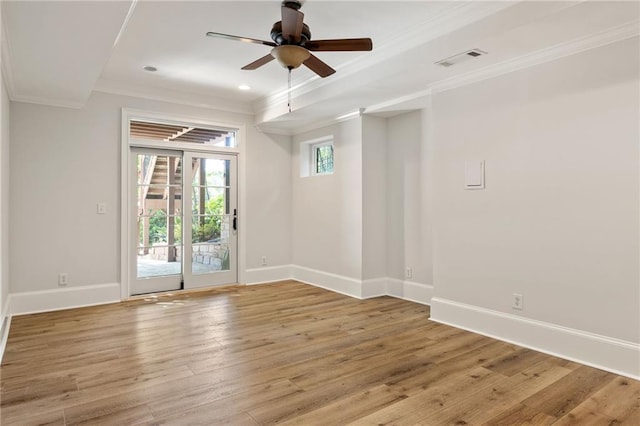 2015 N Decatur Rd NE, Atlanta, GA 30307 - spare room featuring visible vents, baseboards, ceiling fan, light wood-type flooring, and crown molding