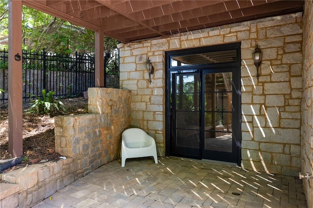 2015 N Decatur Rd NE, Atlanta, GA 30307 - doorway to property featuring fence and stone siding