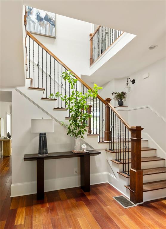 2015 N Decatur Rd NE, Atlanta, GA 30307 - stairs with wood finished floors, baseboards, and visible vents