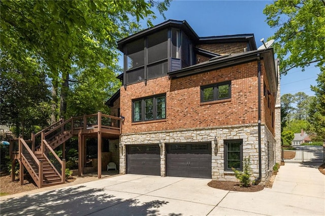2015 N Decatur Rd NE, Atlanta, GA 30307 - rear view of house featuring a garage, stairway, driveway, and stone siding