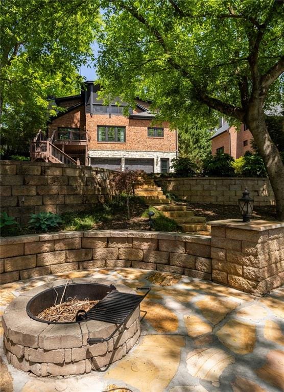 2015 N Decatur Rd NE, Atlanta, GA 30307 - view of patio / terrace featuring an outdoor fire pit and stairs