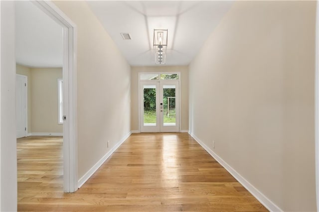 2552 Scenic Hwy S, Snellville, GA 30078 - hall featuring light wood-style flooring, baseboards, and french doors